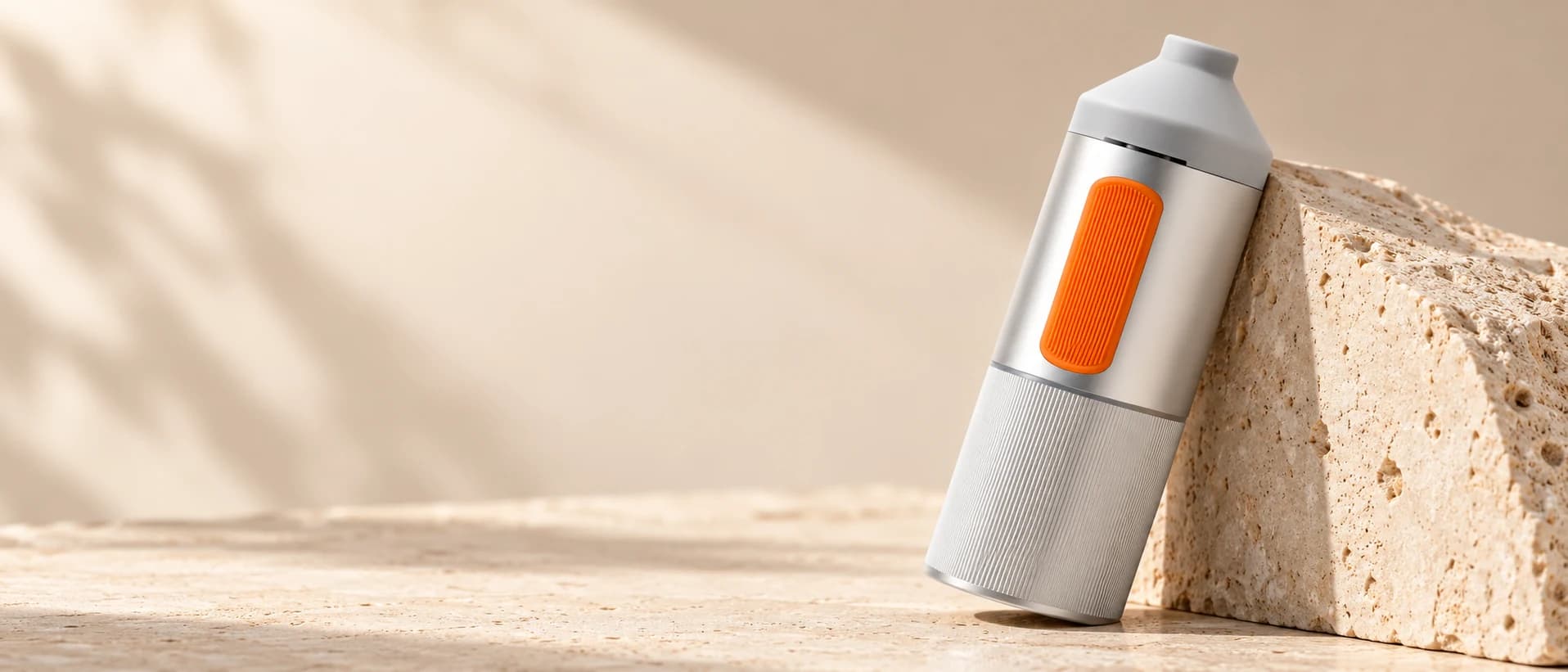 Silver SparkIt TRI with CNC-machined aluminum body against natural stone